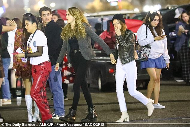 Opposites: Following close behind was Minke, who contrasted her girlfriend in bright white jeans with a distressed hem.