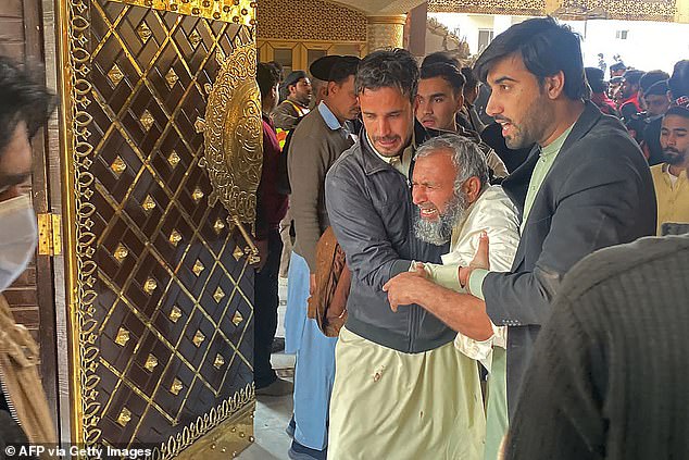 A mourner at the site of the blast in Peshawar, northwest Pakistan