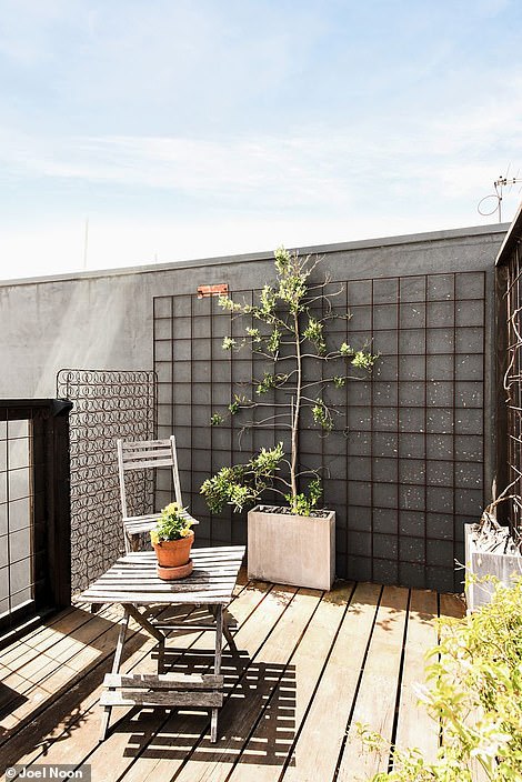 On the roof is another outdoor entertaining area with twinkling views of the Melbourne city skyline.