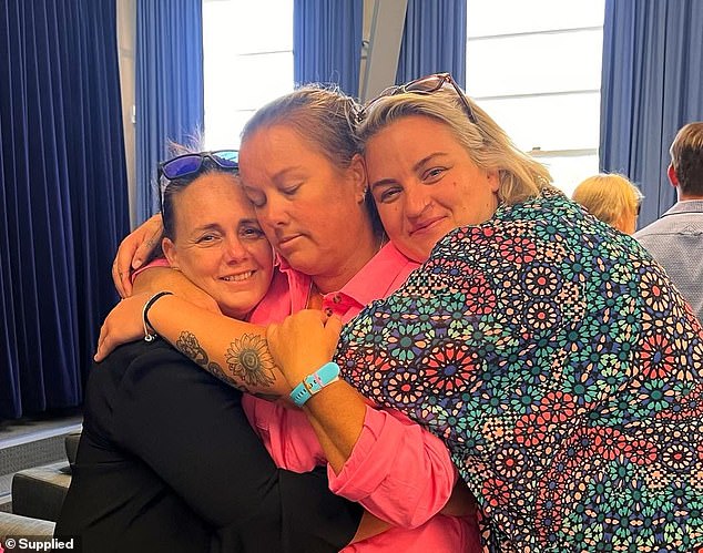 Tamara Harrison (left) and Bec Haddow (right) comfort Samantha Lennon at Imogen's funeral