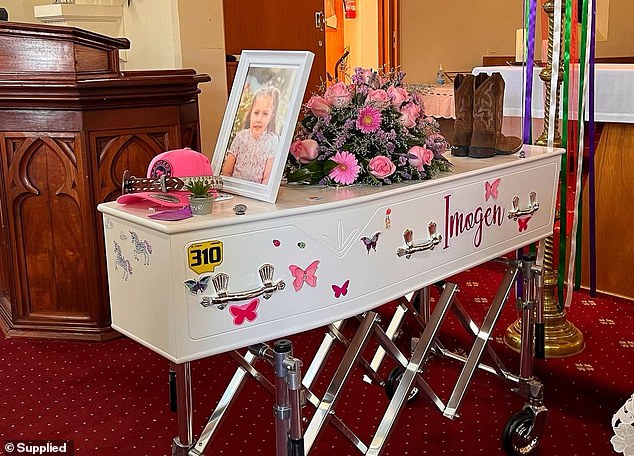 His coffin was adorned with pink flowers, cowboy boots, a pink snapback cap 