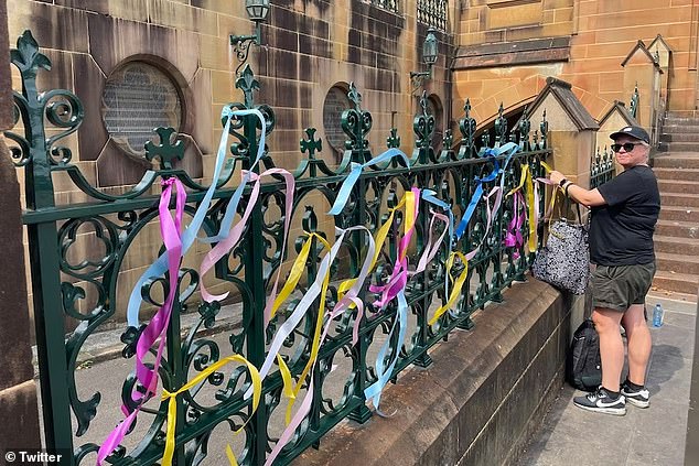 Survivors of sexual abuse have tied colored ribbons to the fences of the Cathedral of Saint Mary, symbolizing clergy sexual abuse.