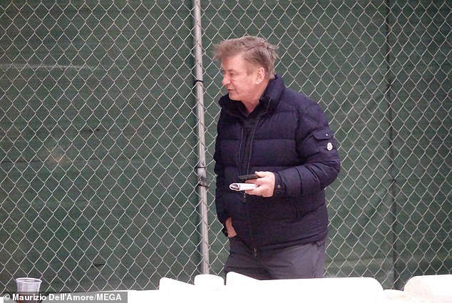 The 64-year-old actor stepped out for a walk alone carrying some papers and bundled up in a navy puffer jacket.