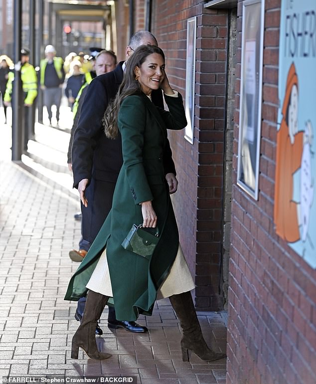 The Princess of Wales matched her emerald coat with a pair of dark brown suede boots as she arrived at Kirkgate Market in Leeds this morning.