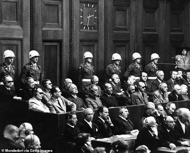 Pictured: The German defendants Hermann Goering, Rudolf Hess, Joachim von Ribbentrop, Wilhelm Keitel, Ernst Kaltenbrunner, Alfred Rosenberg, Hans Frank, Wilhelm Frick, Julius Streicher, Walther Funk, Karl Doenitz, Erich Raeder, Baldur von Schirach, Fritz Sauckel Alfred Jodl, Franz von Papen, Arthur Seyss-Inquart, Albert Speer, Konstantin von Neurath and Hans Fritzsche sitting during the Nuremberg Trials. Germany, November 1945