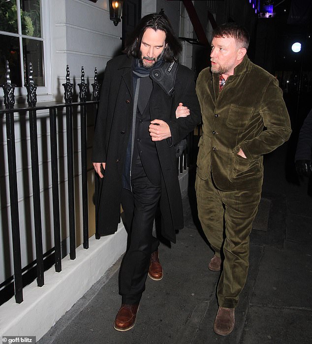 They're out: The couple headed towards separate cars after a night of dinner and drinks at the Mayfair venue