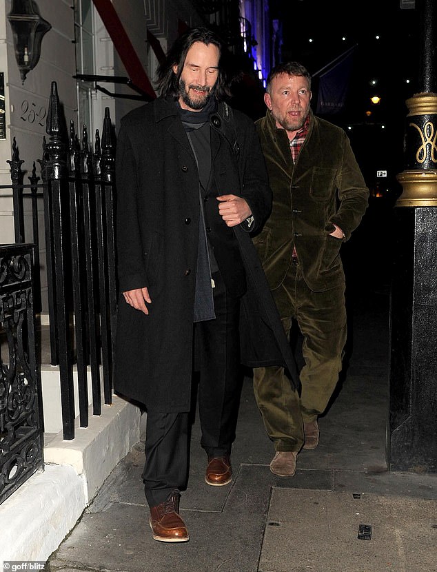 Well-dressed: Reeves looked dapper in a black frock coat, worn over a matching two-piece suit and polished leather shoes