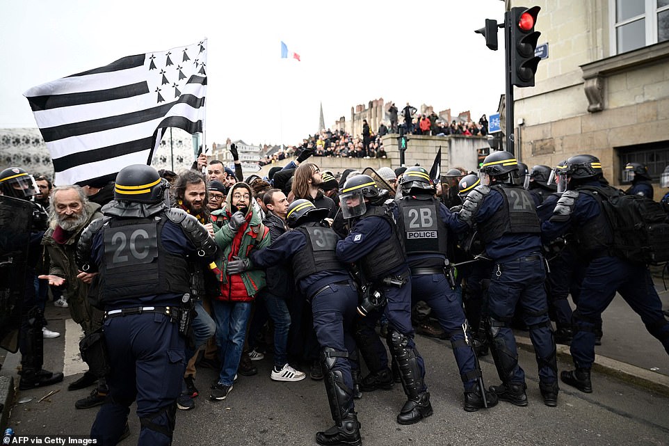 The demonstrations were at first peaceful but they soon became violent in some cities, with protesters clashing with baton-wielding riot police officers in the western city of Nantes (pictured)