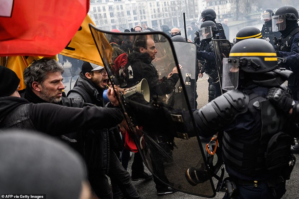 Protesters clash with riot police during demonstrations in Nantes on Tuesday