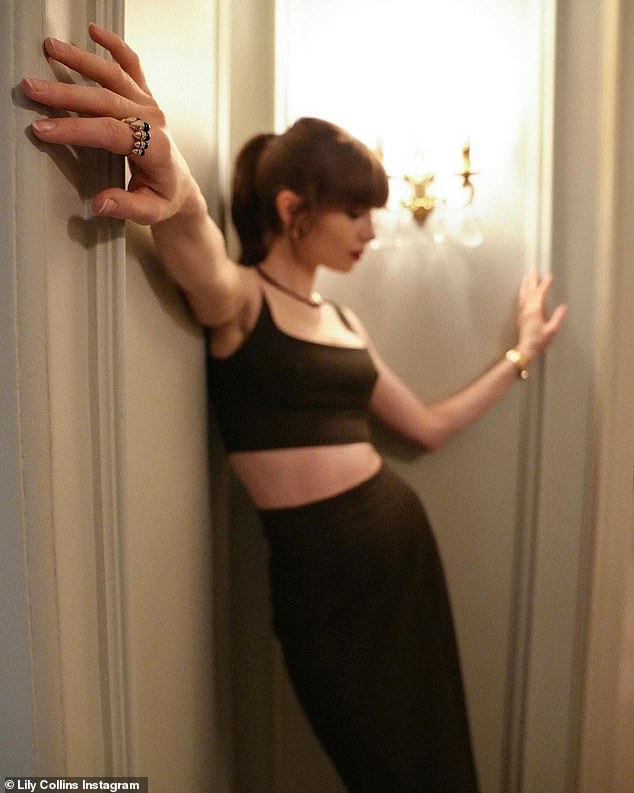 Sultry and sexy: Lily struck a sultry pose in the long, skinny skirt and matching crop top.