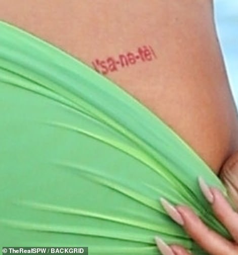 A closer look: The cosmetics giant has had the little red tattoo for many years.