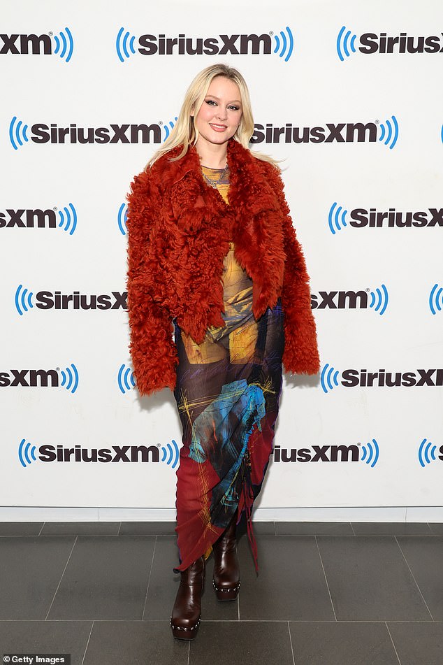 brush it?  Zara posed in a colorful dress and furry jacket on SiriusXM in New York on Tuesday.