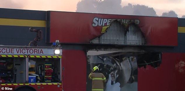 More than 80 firefighters battled the blaze, which started around 5 a.m. Wednesday (pictured, burned-out store front)