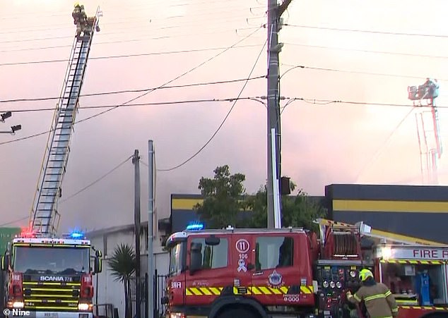 Firefighters were still fighting the fire at 7 a.m. (pictured, firefighters on scene)