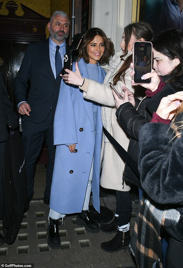 Dedicated: The former Girls Aloud star was mobbed by fans as she walked out the stage door before getting into the back of a car to take her home