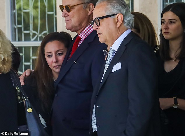 Verónica Tejera, 33, watched as the casket of her husband, ABC producer Dax Tejera, was placed in a hearse in Coral Gables, Florida, on Saturday, two weeks after he died of a heart attack.