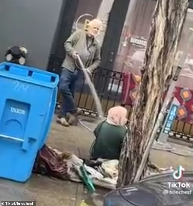 A business owner who went viral after he was filmed spraying a homeless woman with a hose outside his San Francisco store has been arrested for assault, hours after the city's district attorney said he would face charges. for the widely seen incident.