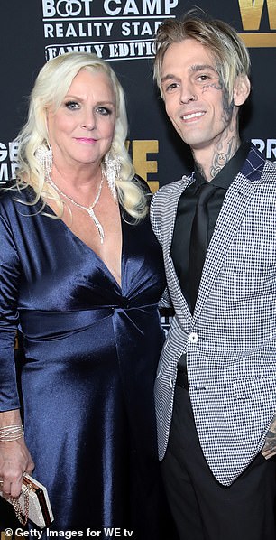 Jane, the mother of Aaron Carter, pictured, claims forensics found no water in the late star's lungs, ruling out drowning as the cause of death.