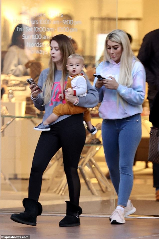 Sighting: Aaron Carter's on-and-off fiancee Melanie Martin (right) stepped out with her son Prince for a spree of shopping in Los Angeles on Monday, a day after claiming the late singer overdosed on drugs and didn't drown in His bathroom.