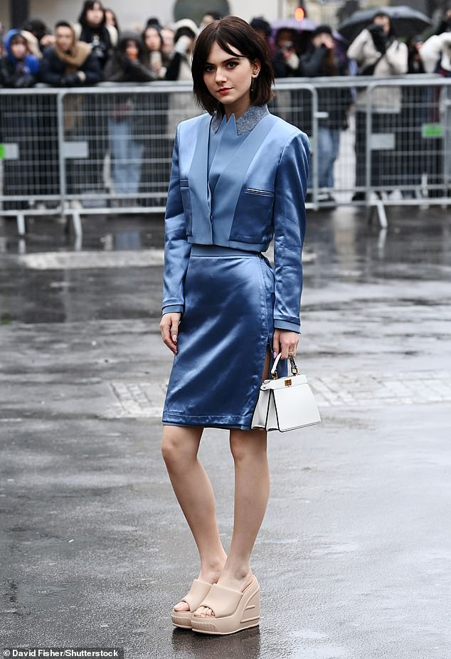 It looks good: Emilia Jones' outfit was enticing enough to melt even the most resilient snowman while attending Paris Fashion Week on Thursday afternoon