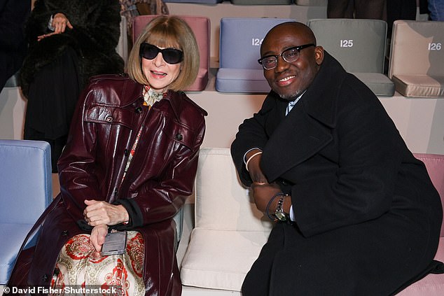 US Vogue editor Anna Wintour and British Vogue editor Edward Enninful smile as they look at the Giorgio Armani show at Paris Fashion Week this afternoon.