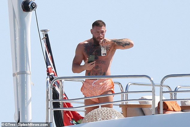 A woman who claimed she was assaulted on mixed martial arts fighter Conor McGregor's yacht had her car set on fire.  The MMA fighter appears on his yacht in Ibiza in July of last year.