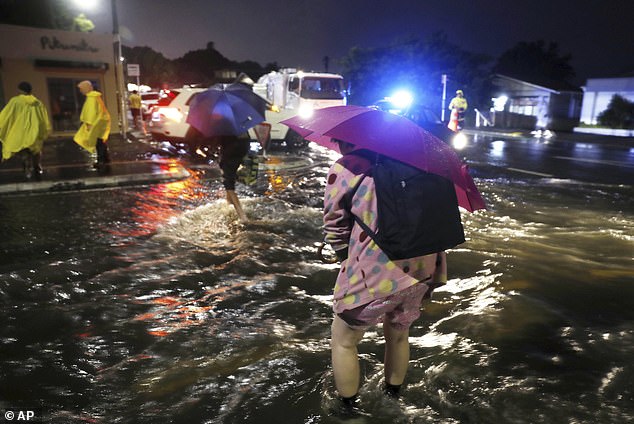 The photos show that hundreds of residents have been displaced throughout the city and the rain will continue until the end of the week (in the photo, residents are flooded)