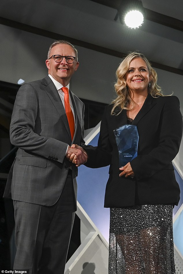 Prime Minister Anthony Albanese presents the 2023 Australian of the Year award to body image activist Taryn Brumfitt at the 2023 Australian of the Year Awards in Canberra