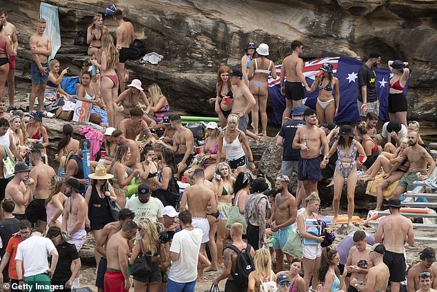 Showers and possible thunderstorms could spoil the second half of the Australia Day celebrations as storms move up the East Coast (Australia Day celebrations pictured)