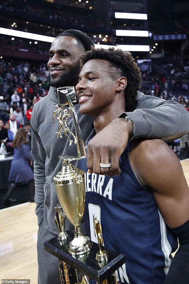 LeBron 'Bronny' James Jr of Sierra Canyon High School with his father LeBron James of the Los Angeles Lakers after the Ohio Scholastic Play-By-Play Classic