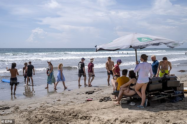 Australians who recently opened a restaurant and bar in Seminyak, Bali, were forced to defend the decision to name the venue after a popular Facebook page (Kuta Beach pictured)