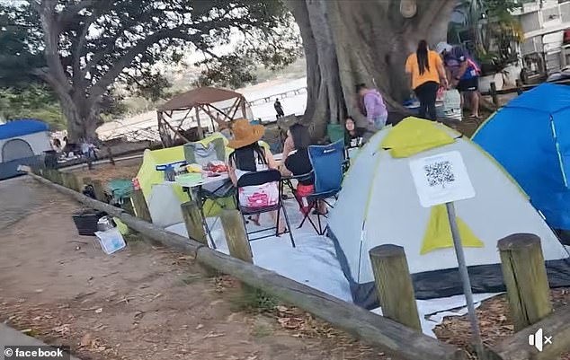 A local has divided residents after complaining about people setting up tents on a popular beach in one of Sydney's most luxurious suburbs.