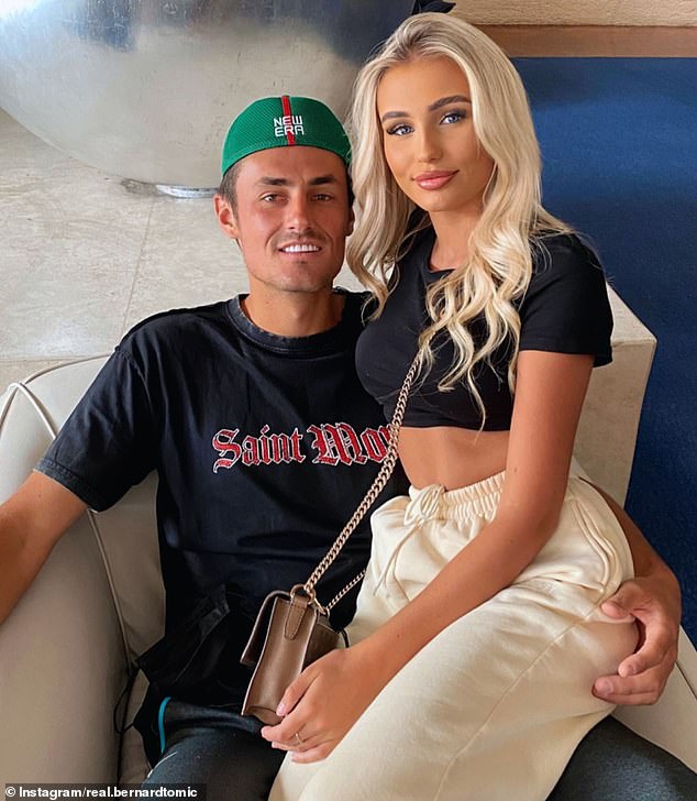 Bernard Tomic's 15-year streak at the Australian Open ended after the fallen star was passed over for a qualifying wild card (pictured with girlfriend Keely Hannah)