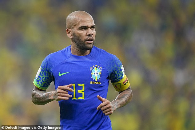 Brazil international Dani Alves has been detained by police in Barcelona and taken to court for questioning after being accused of sexually assaulting a woman.  In the picture: Dani Alves