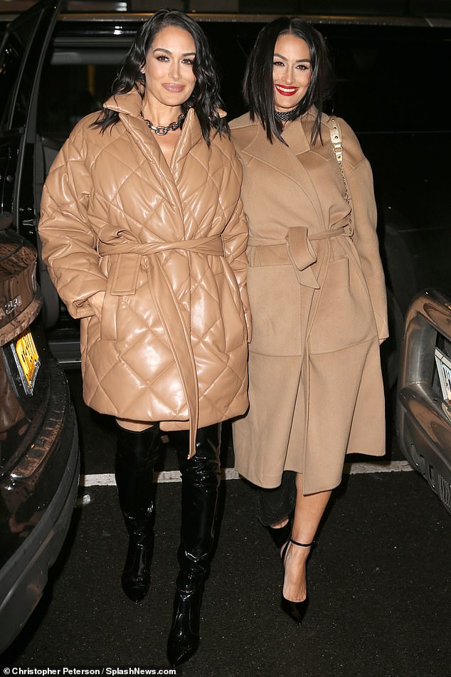Matching: Brie and Nikki Bella wore matching outfits while attending a couple different shows in New York City on Monday (Brie on the left, Nikki on the right)