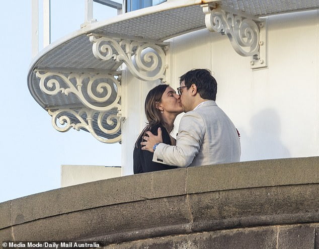 Brittany Higgins and David Shiraz kissed to seal their engagement atop the Byron Bay lighthouse on Saturday (pictured)