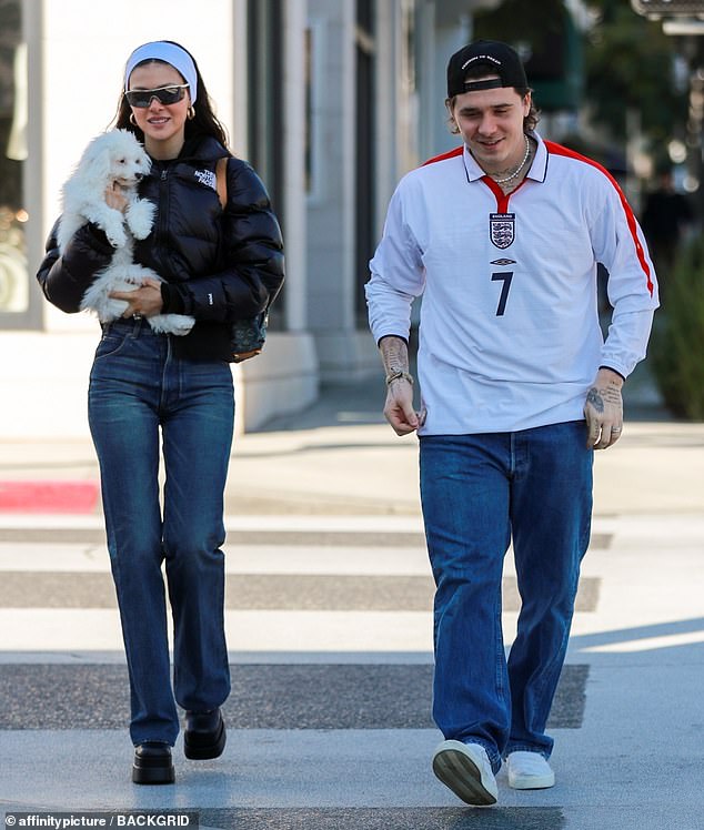 Married couple: Brooklyn Beckham and Nicola Peltz were all smiles as they strolled through Los Angeles on Sunday