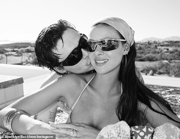 Kiss-kiss: Brooklyn filled out the PDA with wife Nicola Peltz in a photo dump shared to her Instagram Monday during their luxury yacht trip in Los Cabos, Mexico