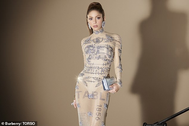 Dazzling: Singer Shakira wears a Burberry dress.  The British luxury brand blames lockdowns and the reopening of China's economy for a massive drop in sales in the country