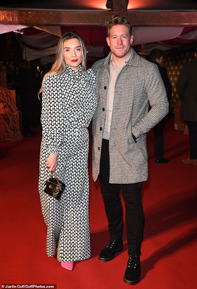 Beloved: Candice Brown, 38, snuggled up with boyfriend Nicky Mercer at the Cirque Du Soleil premiere of KURIOS held at London's Royal Albert Hall on Wednesday night.