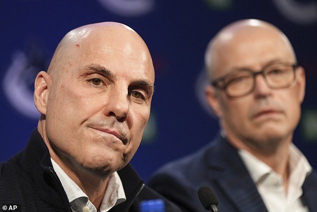 Vancouver Canucks head coach Rick Tocchet, left, and general manager Patrik Allvin listen during a news conference after the NHL hockey team announced the hiring of Tocchet in Vancouver, British Columbia , Sunda.