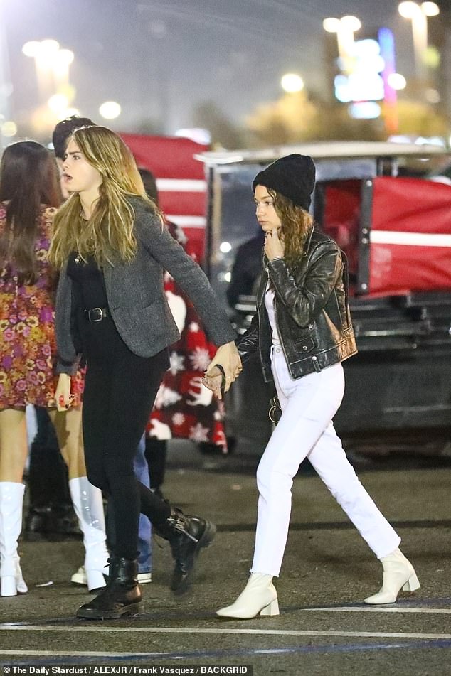 cara and harry holding hands