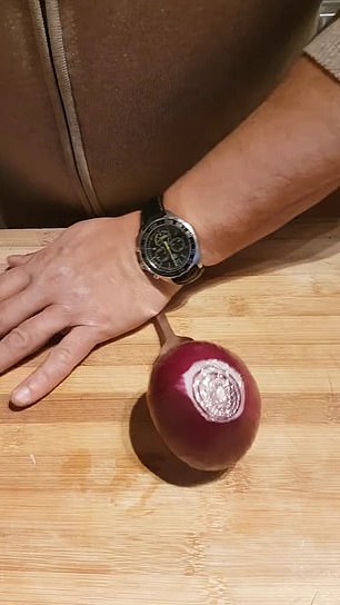 A savvy cook has wowed millions after revealing how to thinly slice an onion with a fork and vegetable peeler.