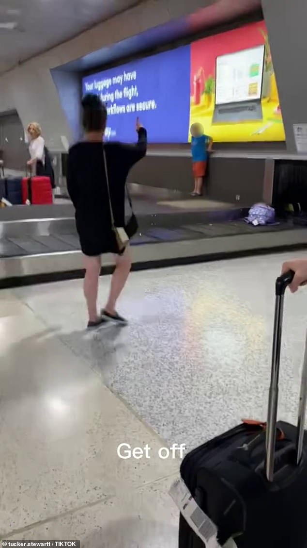 The shocking vision shows a boy wreaking havoc on a baggage carousel at Melbourne airport, running along the carousel and knocking over people's luggage to the horror of onlookers.