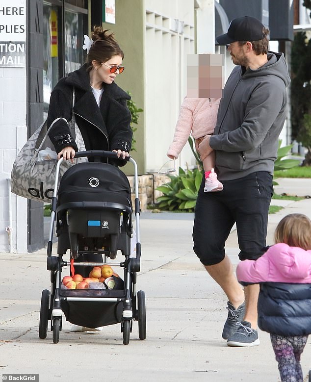 Casual Sunday: Chris Pratt and Katherine Schwarzenegger looked casual as they spent part of their Sunday morning at the Farmers' Market with their daughters  Chris, 43, stepped out in knee-length joggers, a gray hoodie, sneakers and a black peaked cap.