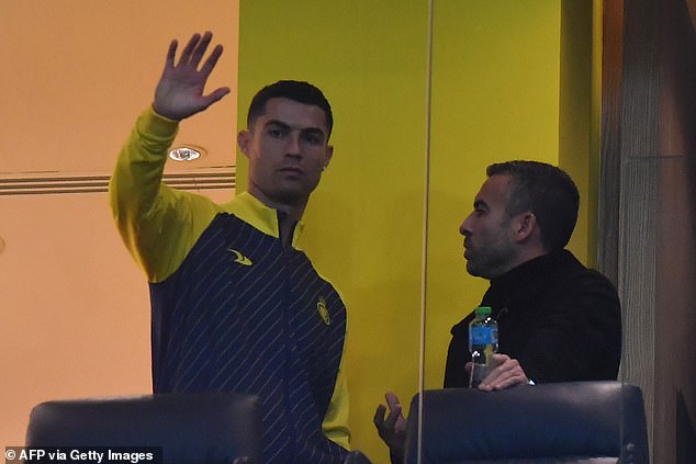 Cristiano Ronaldo (left) watched from a VIP box as his new team, Al-Nassr, beat Al-Ta'ee 2-0