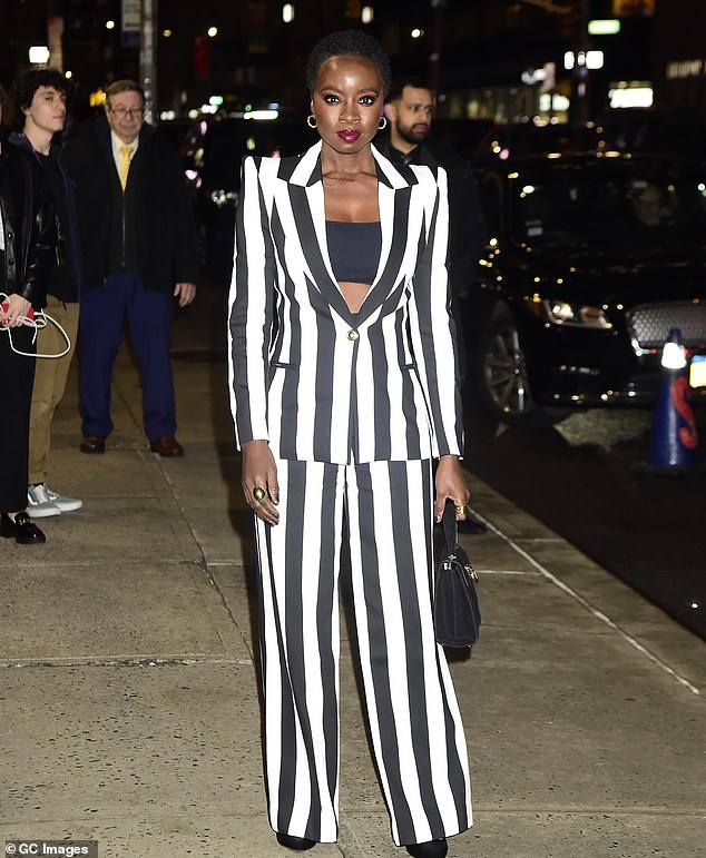 Pinstripe suit: Danai Gurira stood out in a pinstripe suit on Thursday as she made her way to a talk show studio in New York City.