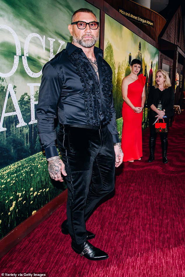 Ready for something new: Dave Bautista expressed fear that his burly muscular frame and array of tattoos would prevent him from landing a role as the male lead in a romantic comedy;  photographed Monday night