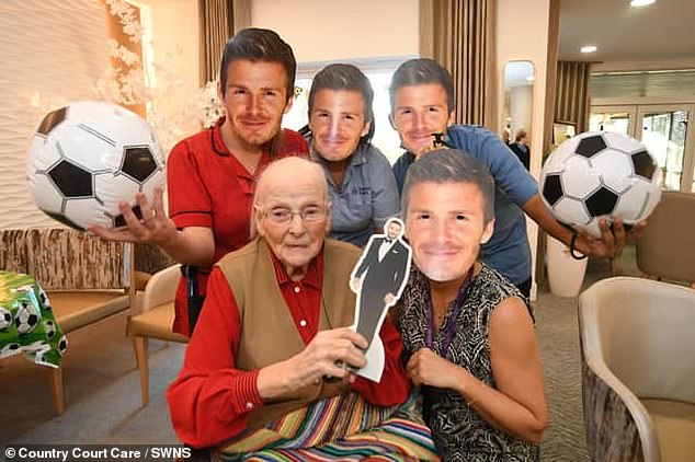 Celebration: David Beckham surprised his 'oldest fan' with a video message this week that was played during a surprise party honoring his favorite footballer (Mona Hurry, 102, pictured)