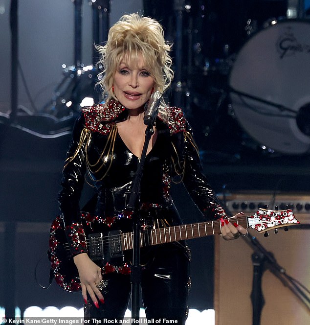 'Here I am at 77 and I'm going to be a rock star!'  Legendary country singer Dolly Parton is revealing more details about her first rock 'n' roll album, Rock Star, which is rumored to be out this fall (pictured November 5).